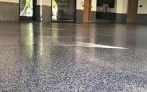 Beautiful high-gloss epoxy and polyaspartic full-flake flooring.